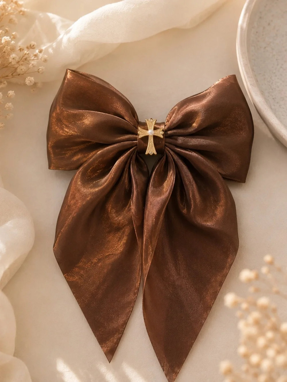 Shimmering Brown Bow Hair Clip with Gold Cross Accent
